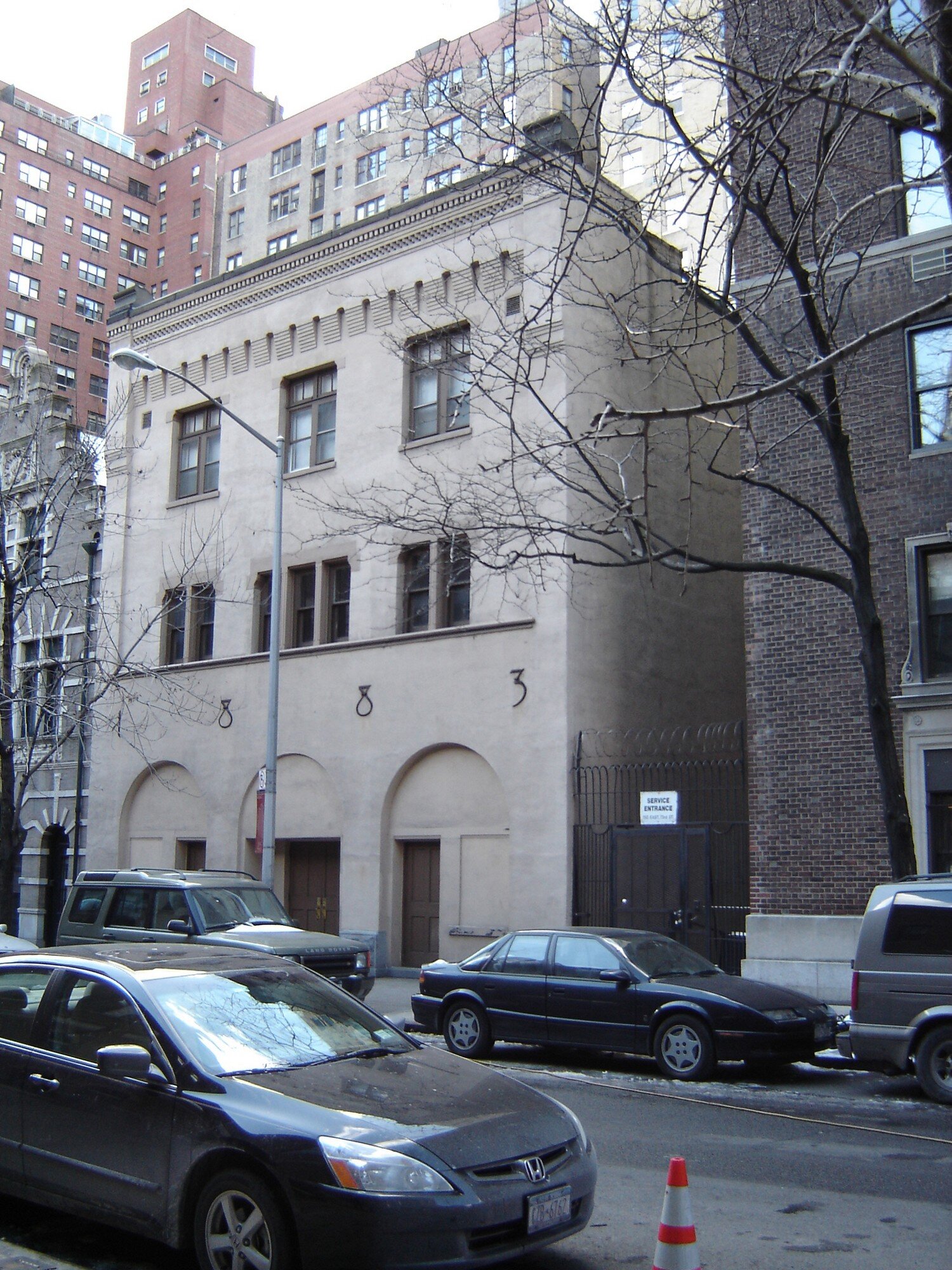 New York City townhouse exterior with arched openings
